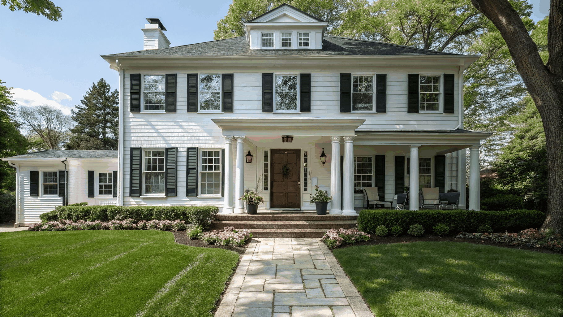 Modern residential home exterior in Elgin, Illinois, bathed in warm afternoon sunlight